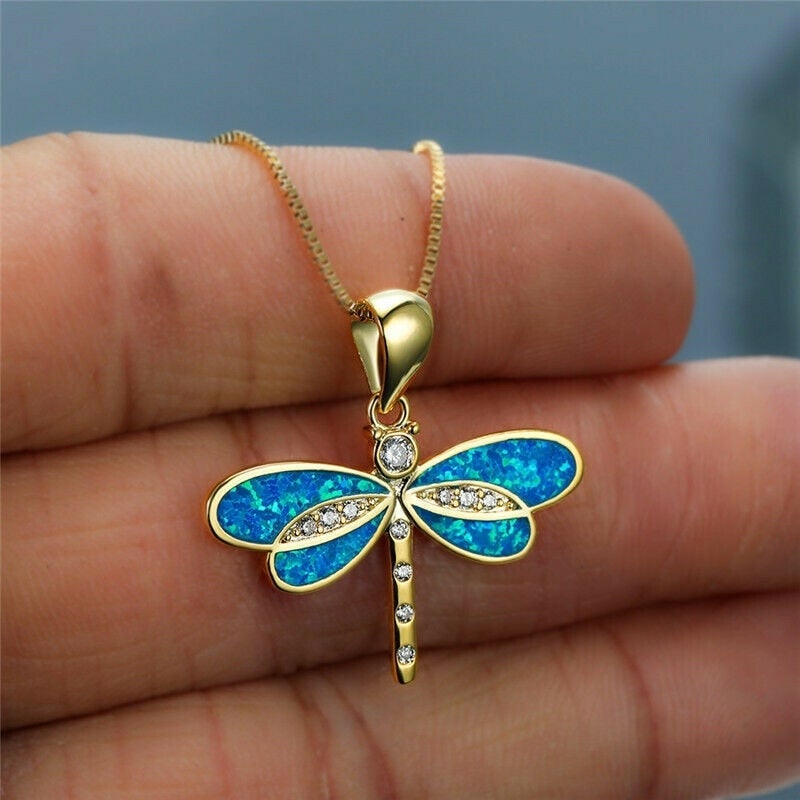 Collier dorato a farfalla con opale
