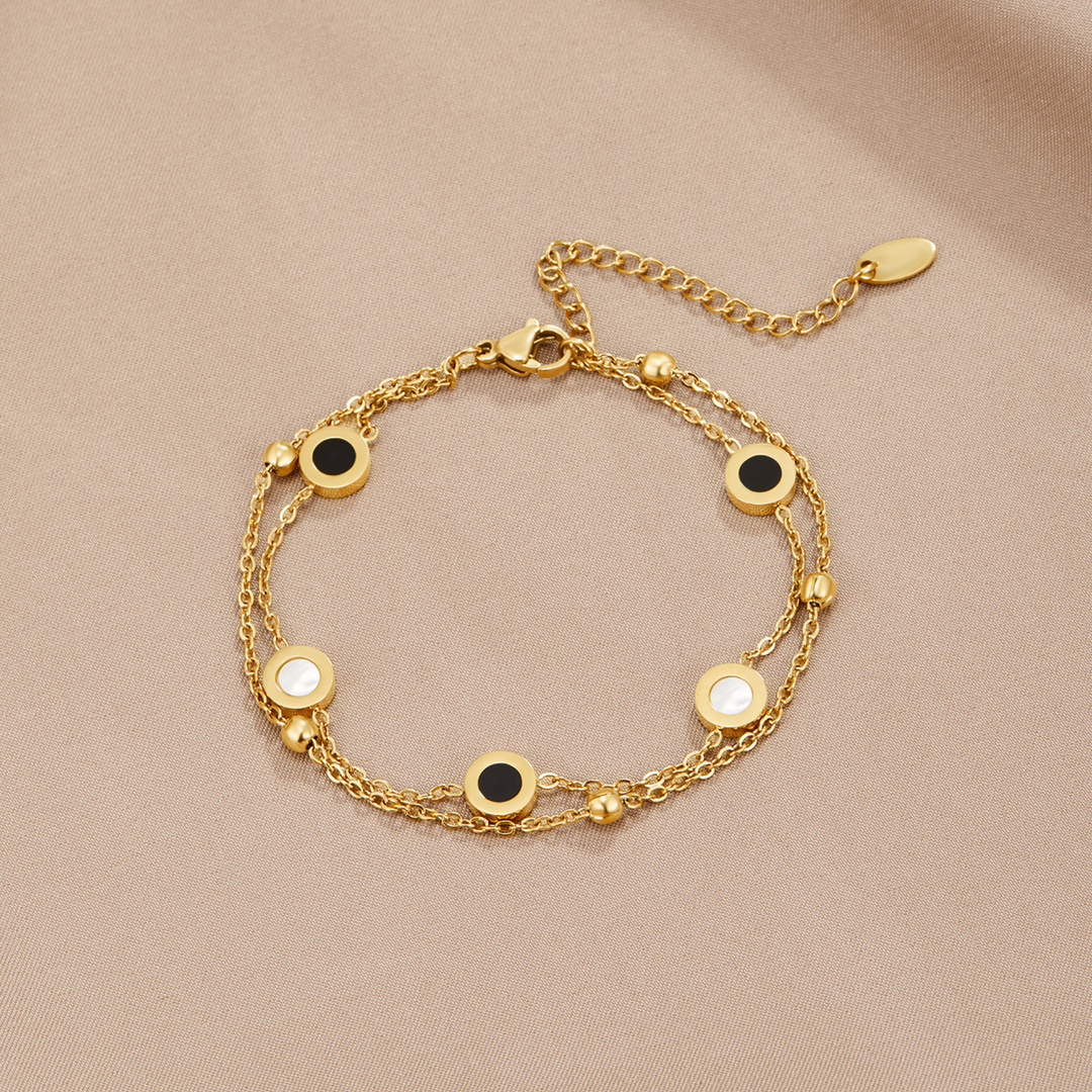 Carla – Bracciale delicato dorato con elementi rotondi a contrasto