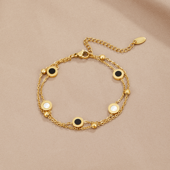 Carla – Bracciale delicato dorato con elementi rotondi a contrasto
