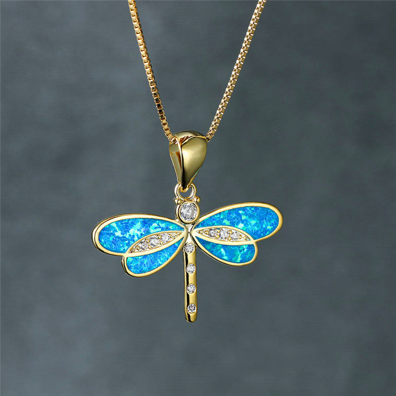 Collier dorato a farfalla con opale