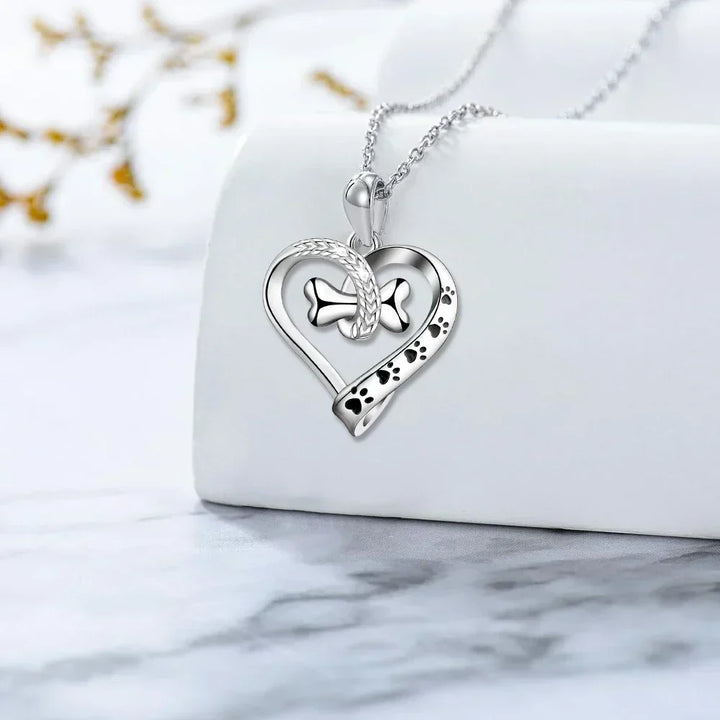 Set di gioielli in 2 pezzi con pendenti a forma di zampa, cuore e osso