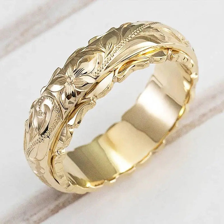 Anello dorato floreale ispirato all’antichità