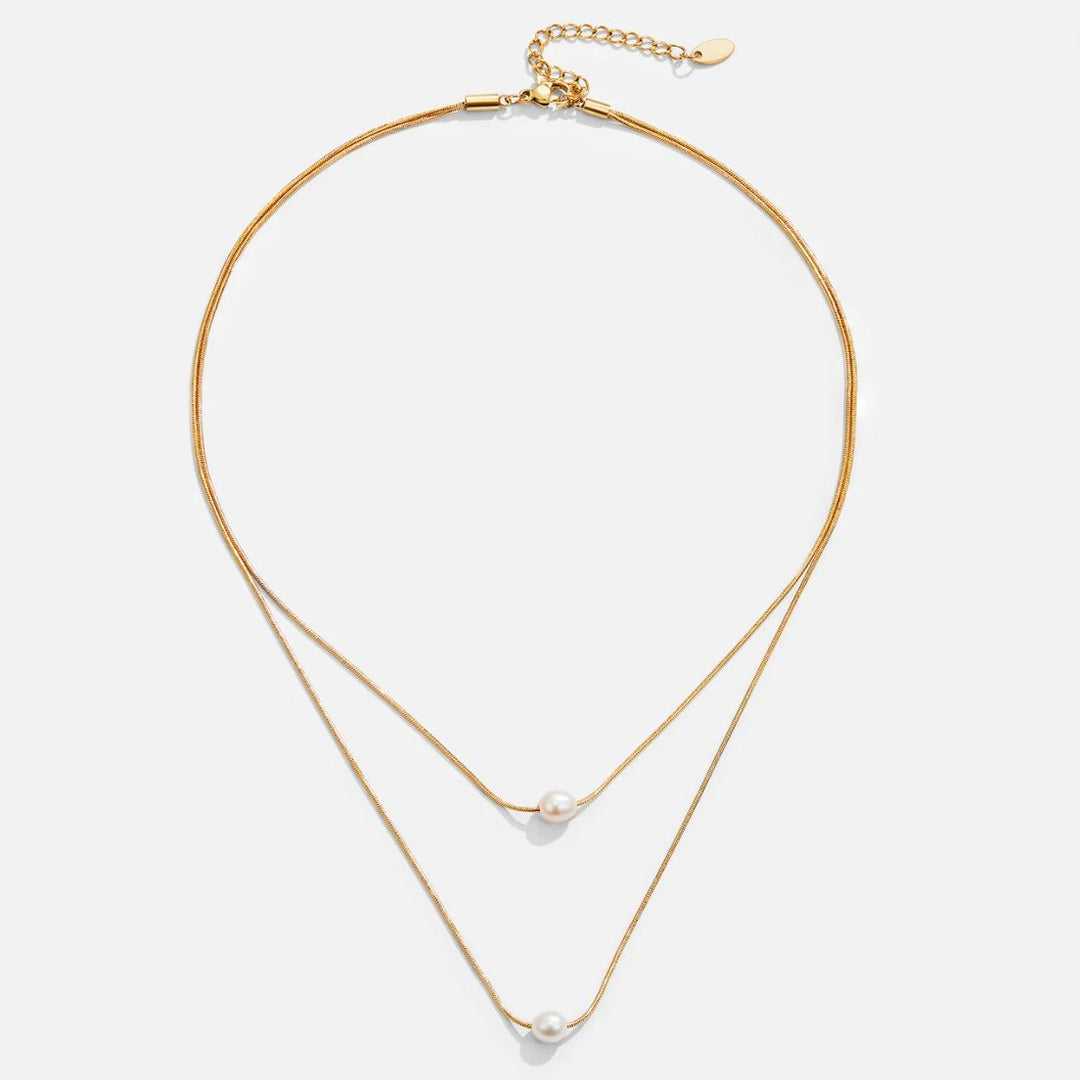 Sabine – Collana dorata a due strati con pietra scura