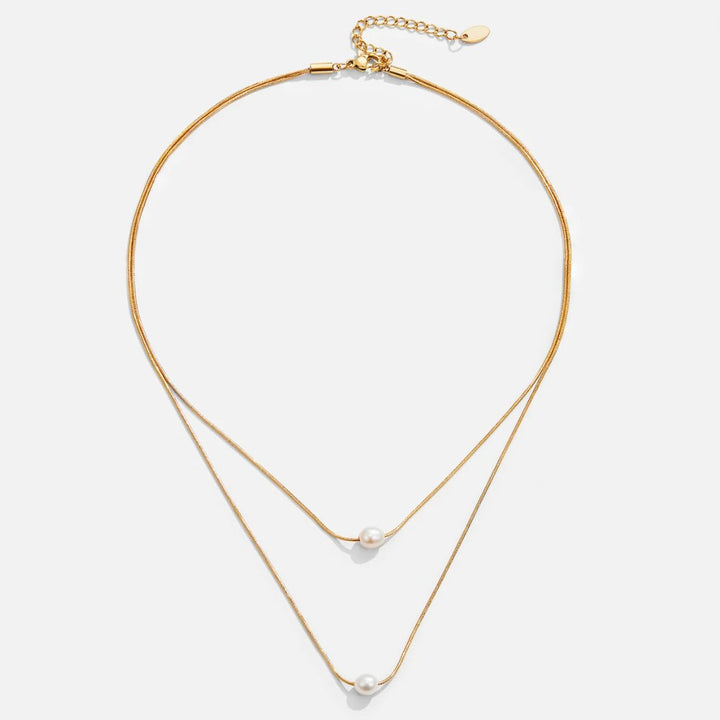 Sabine – Collana dorata a due strati con pietra scura