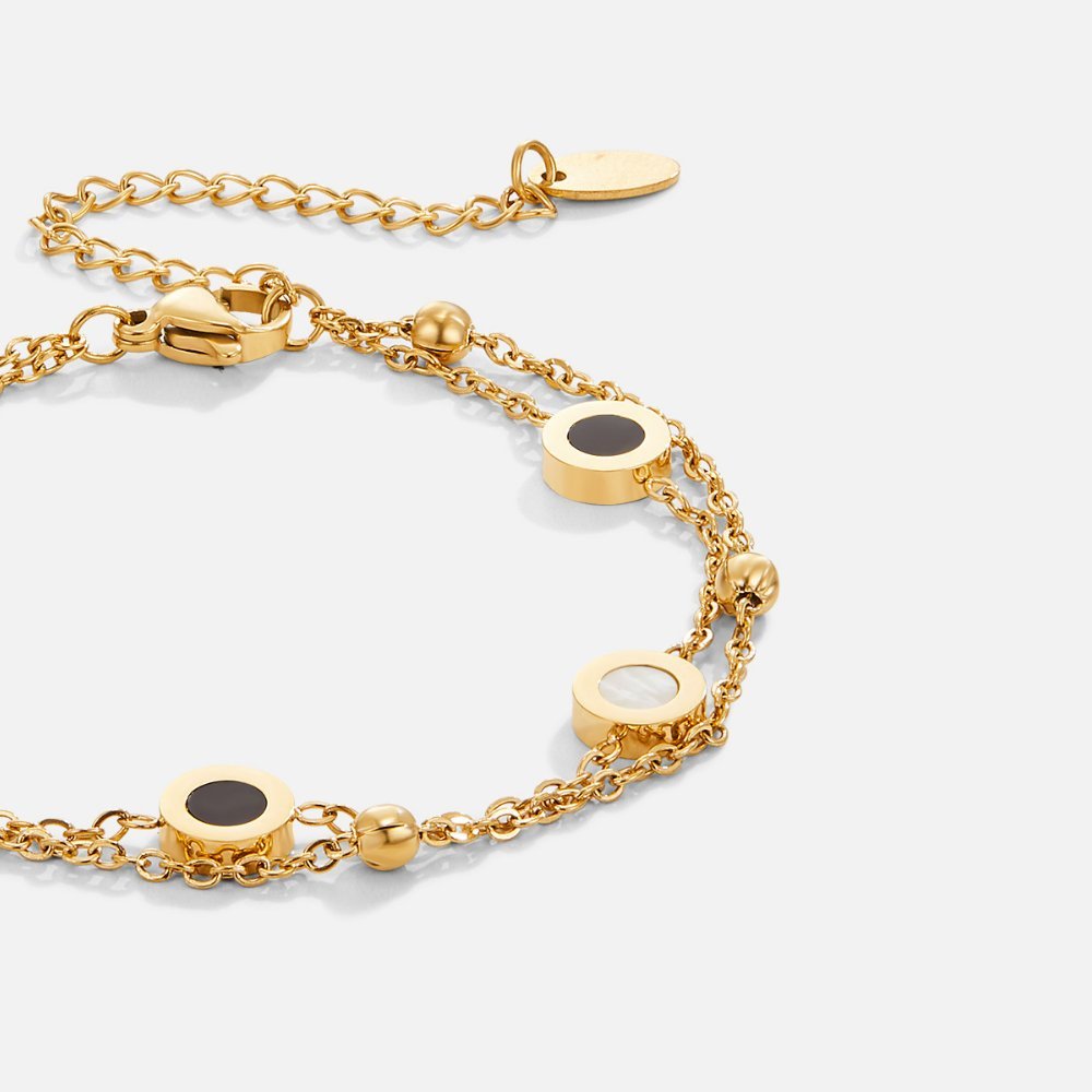 Carla – Bracciale delicato dorato con elementi rotondi a contrasto